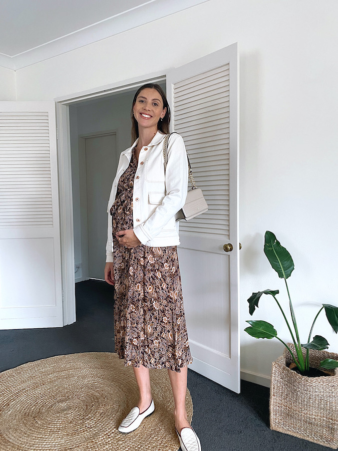 Maternity outfit floral dress, loafers and white denim jacket