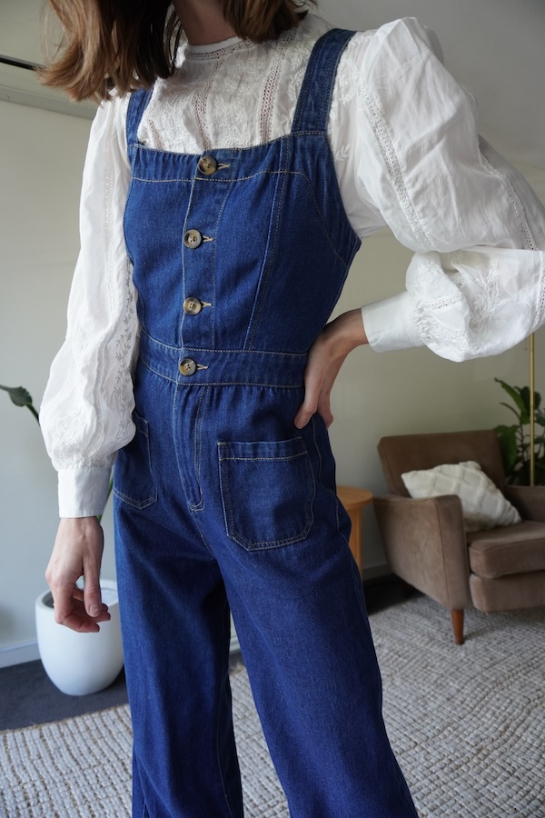 layering white blouse with jumpsuit close up